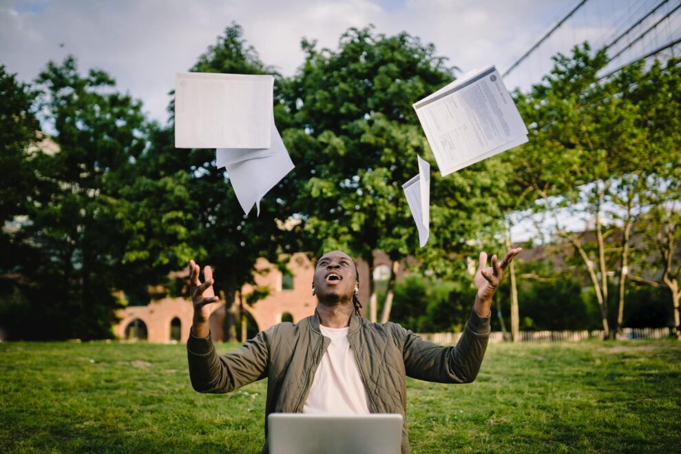 excited african american male student celebrating successful results of exams